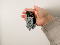 Load image into Gallery viewer, mini macrame keychain in the color laurel next to a key fob.